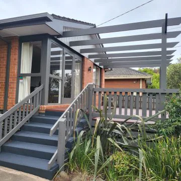 Freshly painted exterior stairs, rails and pergola frame
