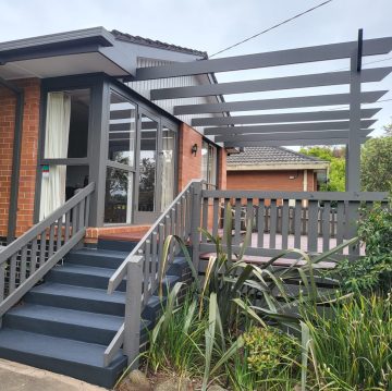 Freshly painted exterior stairs, rails and pergola frame